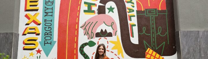 Michelle Joy, Harbors and Havens influencer in front of Shops at Legacy East Howdy Texas mural