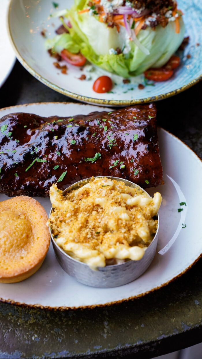 Couple in the Kitchen at Haywire in Plano - ribs, mac and cheese, salad, and cornbread