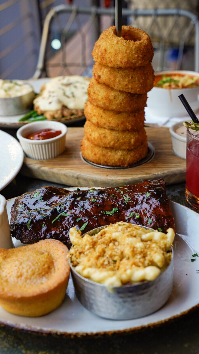 Couple in the Kitchen at Haywire in Plano - onion rings and ribs