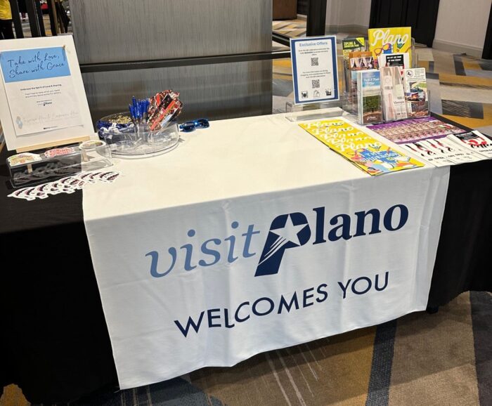 Visit Plano welcome table at a client event